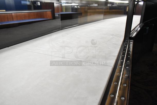 Lighted curved wooden jewelry display case with rear doors and drawers. Bring tools for removal.