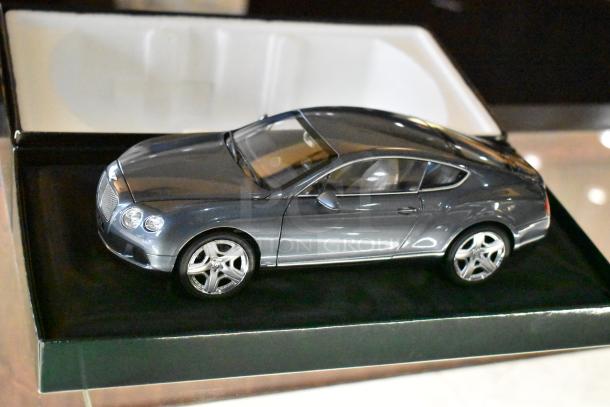 Bentley Continental GT model by Minichamp in original box, gray, pristine condition, showcasing detailed exterior features.