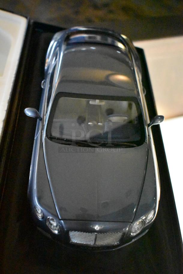 Gray Bentley Continental GT Minichamp model in original box; features detailed design and pristine condition.