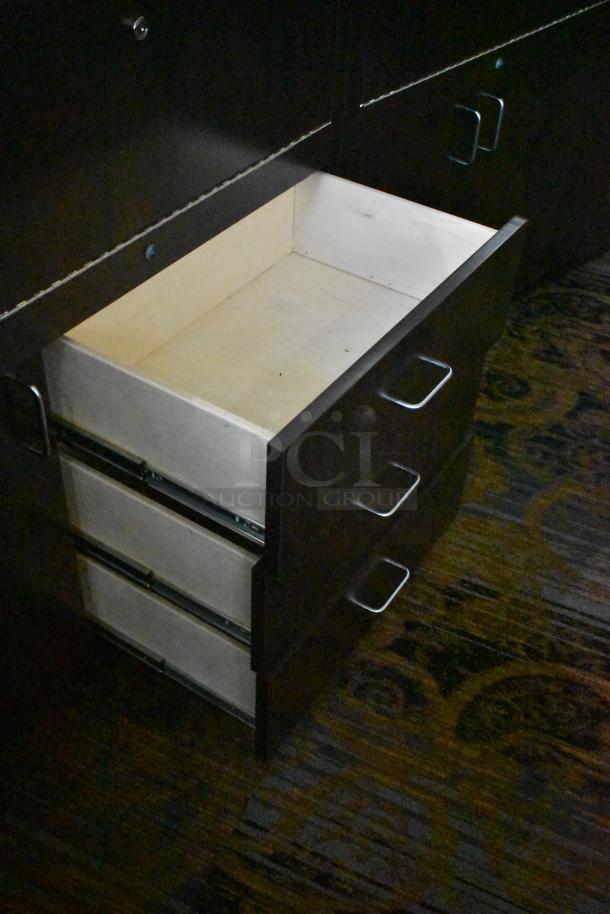 Wooden lighted jewelry case with 3 rear doors and 3 drawers, open drawer view, sturdy metal handles, dark finish.