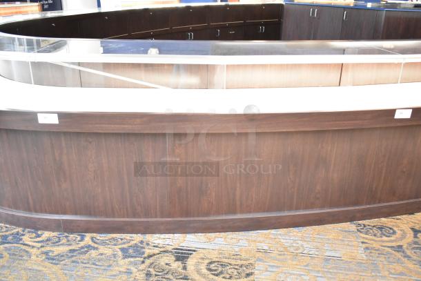 Wooden lighted jewelry case with three rear doors and three drawers, in excellent condition. Buyer removal required.