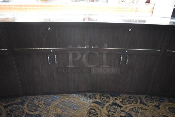 Wooden lighted jewelry case with glass top, features four rear doors and metal handles. Removal requires tools and manpower.