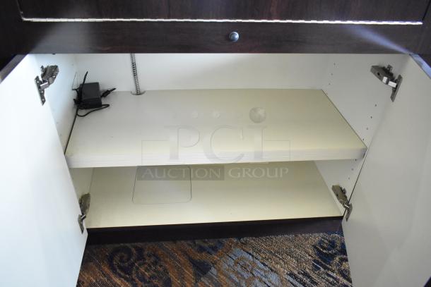 Wooden jewelry case with three rear doors, three drawers, interior lighting, good condition. Buyer must remove.