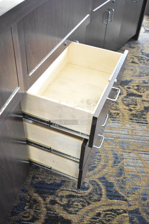 Wooden lighted jewelry case with three rear doors and drawers, in good condition. Buyer must bring tools and manpower.