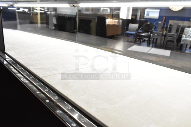 Wooden lighted jewelry case with three rear doors and drawers, glass top, excellent condition. Buyer must remove.