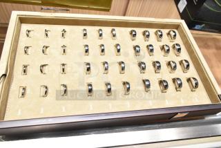 Ring sizing kit with Art Carved case, sizes 3.5 to 16 including half sizes, neatly displayed in a beige tray.