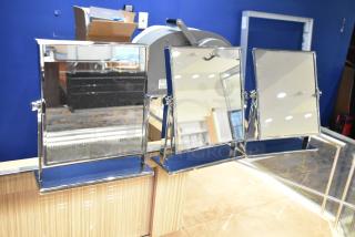 Three countertop mirrors with chrome frames, adjustable angles, in excellent condition, on a wooden surface.