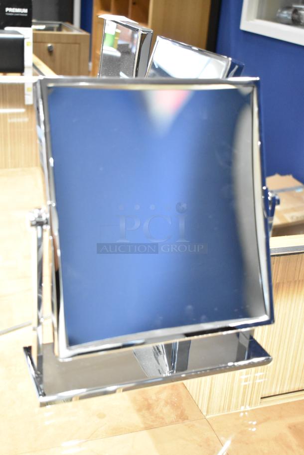 Three countertop mirrors with chrome frames, adjustable design, and reflective surfaces. Ideal for bathrooms or vanities.