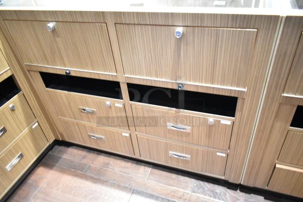 Wooden lighted jewelry case with glass top and four rear drawers, missing key. Removal requires tools and manpower.