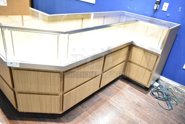 Wooden lighted jewelry case, glass top, 4 rear drawers, no key. Buyer removal required. Used, good condition.