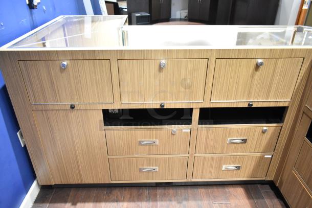 Wooden lighted jewelry case with glass top, four rear drawers, lockable compartments, no key included. Buyer must disassemble.