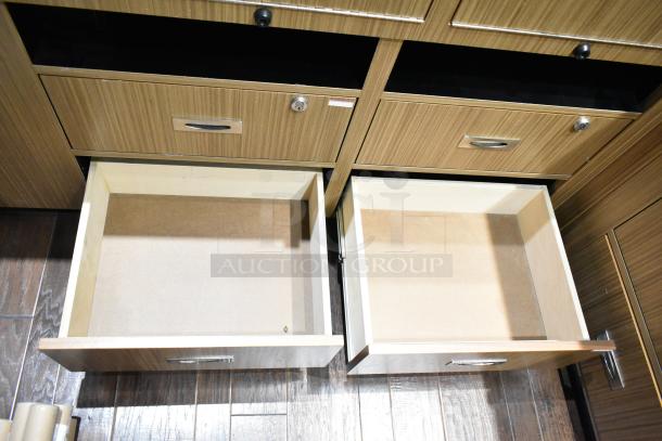 Wooden lighted jewelry case with four rear drawers, visible handles, missing key. Removal tools needed.