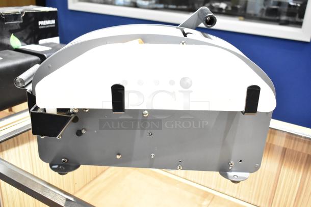 Better Packages 333 Plus Manual Kraft Tape Dispenser, gray body, in good condition, shows dispenser mechanism and handle.