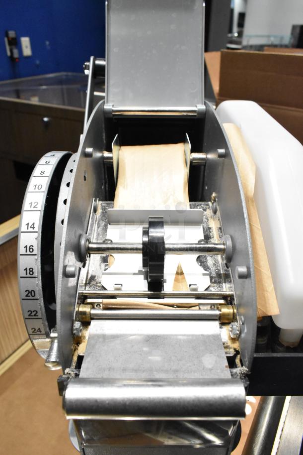 Better Packages 333 Plus manual kraft tape dispenser in good condition, featuring a metal body and measurement dial.