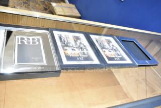 Four picture frames including a Reed & Barton 4x6 frame and three 5x7 frames, displayed on a table.