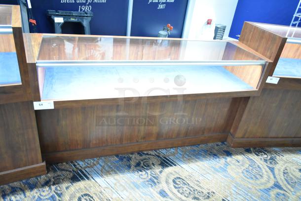 Wooden lighted jewelry case with glass display, excellent condition. Buyer must remove with tools and manpower.