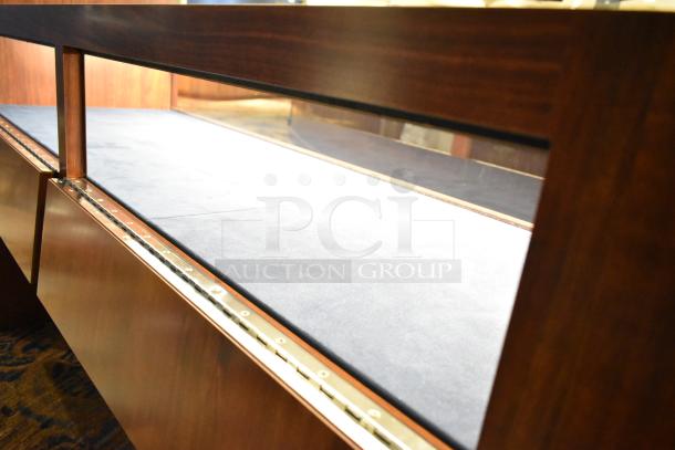 Wooden lighted jewelry case, glass display, dark wood finish, high-quality condition. Buyer must bring tools for removal.