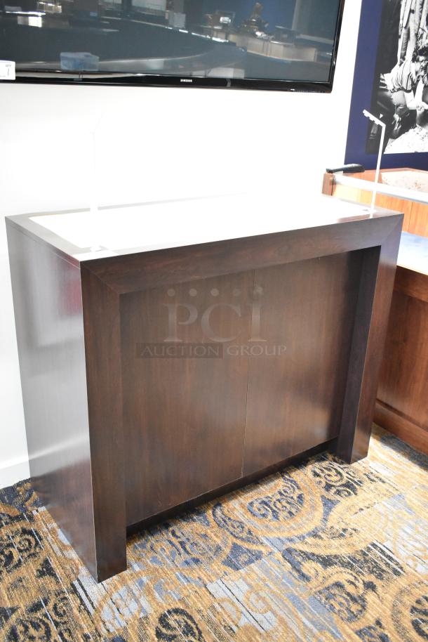 Dark wood rectangular desk with a minimalist design, smooth finish, and no visible damage. Ideal for office or home use.