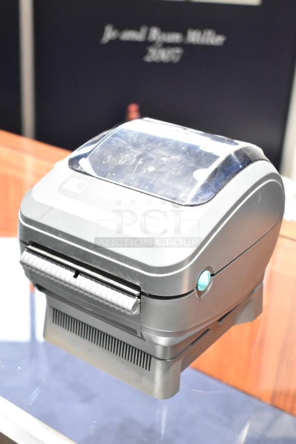 Zebra ZP 450 Label Thermal Printer, sleek black design, visible button and label slot, lightly used condition.