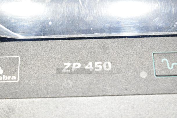 Zebra ZP 450 label thermal printer, close-up view showing model marking, used condition, some wear visible.