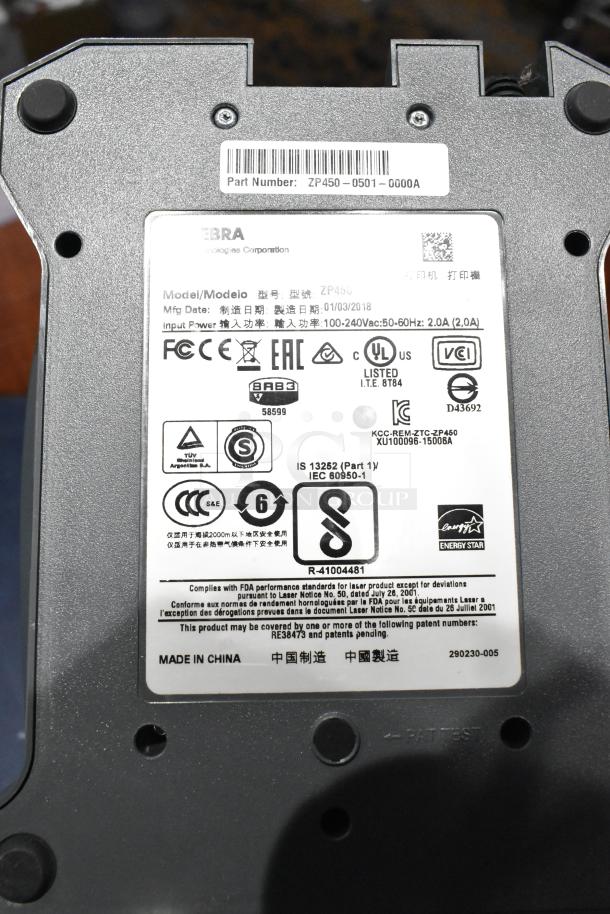 Zebra ZP 450 Label Thermal Printer, model ZP 450, shows certification labels. Part number ZP450-0501-0000A. Made in China.