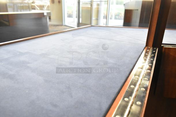 Wooden corner lighted jewelry case with 2 rear doors and 3 drawers, blue lining, metal hinge detail, good condition.