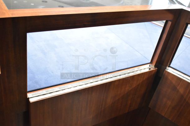 Wooden corner-style lighted jewelry case with 2 rear doors, 3 drawers, and glass top. Buyer must remove; tools needed.