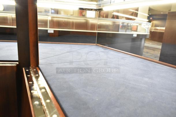 Wooden corner style lighted jewelry case with two rear doors, three drawers, and glass paneling. Includes removal notice.