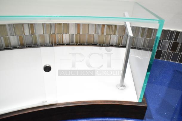 Glass countertop display case with metal supports, clear panels, and a wooden base. Excellent condition. Ideal for showcasing items.