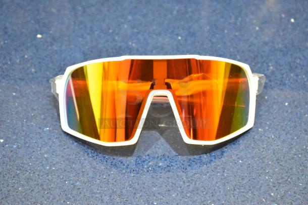 Brand new white framed sunglasses with vibrant orange lenses, perfect condition.