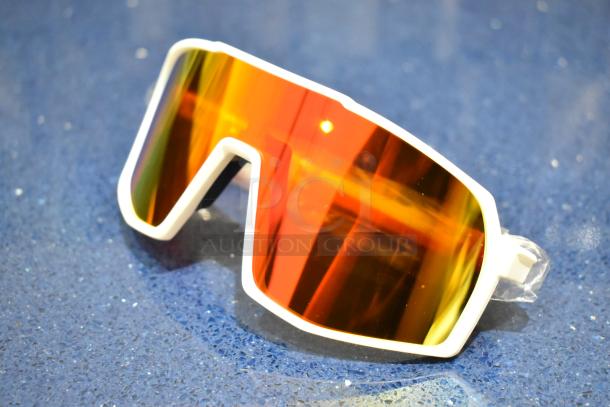 Brand new white framed sunglasses with orange lens, reflective coating, modern design, pristine condition.