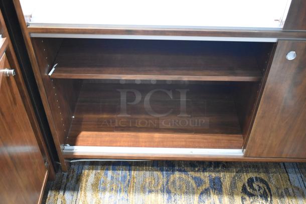 Wooden lighted jewelry case with removable shelves and a glass top. Good condition. Buyer must remove; bring tools.