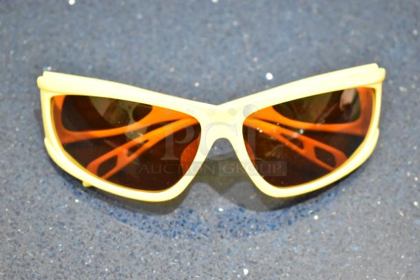 Brand new Viper sunglasses with yellow frame and red lenses, showcasing a stylish design and pristine condition.