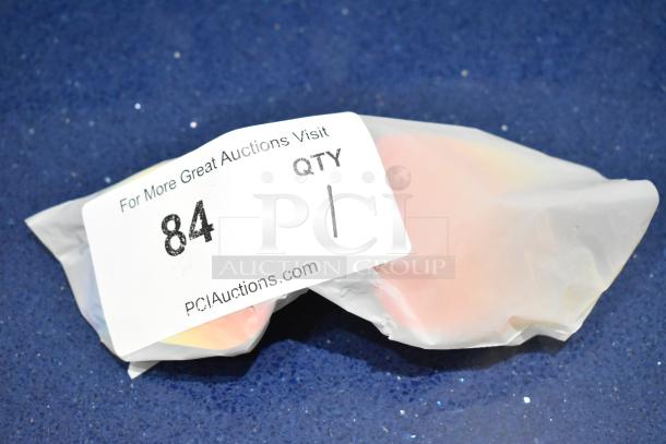 Brand new gray framed sunglasses with orange lenses, wrapped in packaging. Auction label shows item number 84.