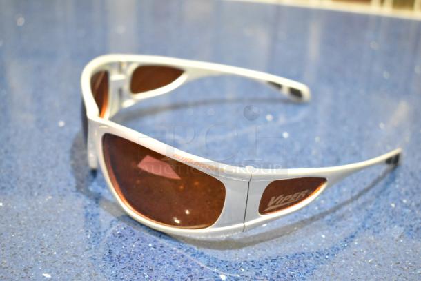 Brand new Viper white frame sunglasses with BluBlocker orange lenses, showcasing distinct labels on sleek design.