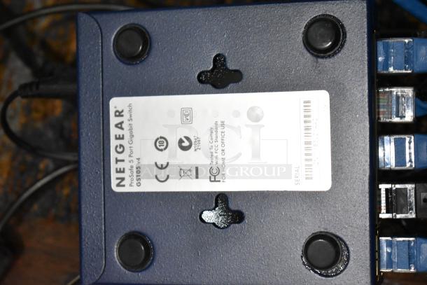 Netgear GS105 ProSafe 5 Port Gigabit Switch, shown with label detailing model and compliance information, part of a 4-item auction lot.