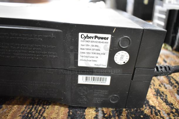 CyberPower 1350VA Intelligent LCD UPS Battery Backup, 125V, 1 Phase, model CST1300AL. Input: 125V, 12A, 60Hz.
