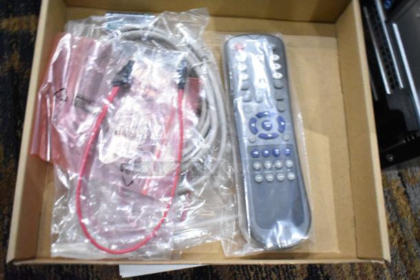 Box with remote, phone cord, HDMI cable, mouse pads, VGA transmitter, VPN router, switch, fingerprint scanner, mouse.