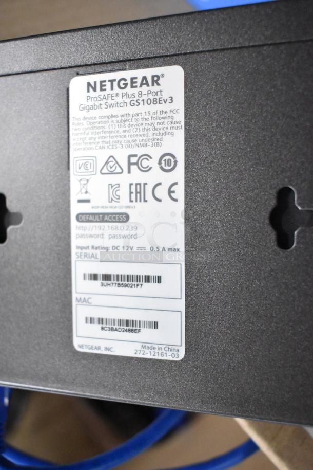 Netgear ProSAFE Plus 8-Port Gigabit Switch GS108Ev3 with label showing compliance markings and default access info. Made in China.