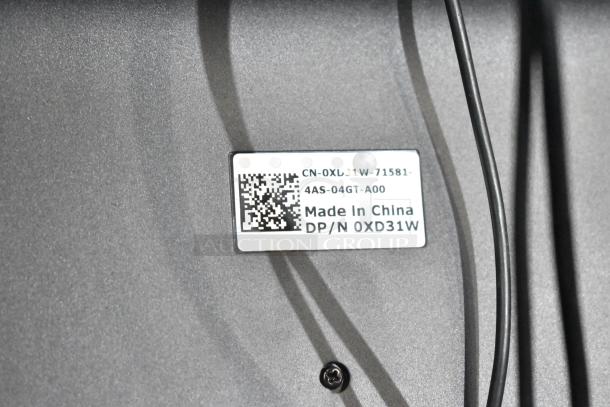 Label on electronic item indicating "Made in China" with code CN-0XD31W-71581-4AS-04GT-A00 and DP/N 0XD31W.