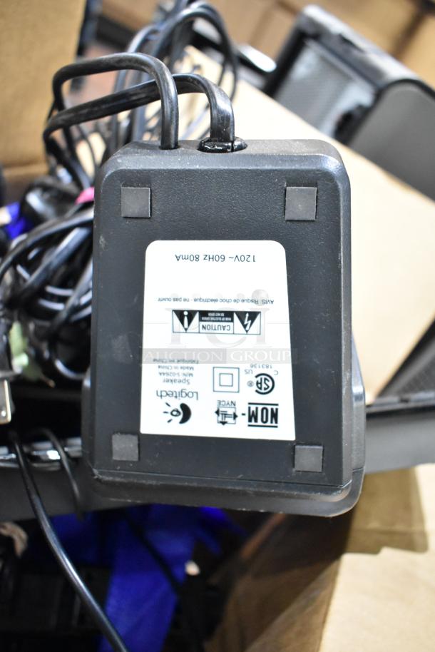 Logitech power adapter with labels indicating voltage (120V, 60Hz, 80mA) and safety certifications. Part of 6-item lot.