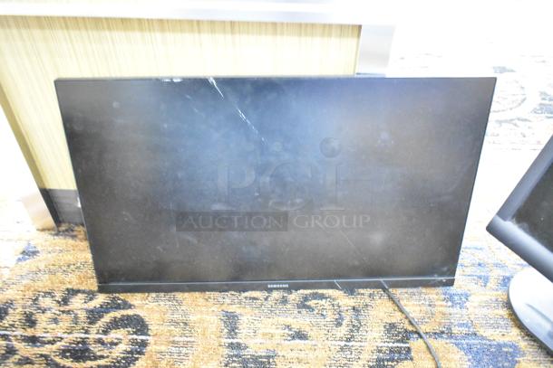 2 computer screens: Samsung S24R356FHN, large display with visible scratch; Dell E172FPb, compact, in used condition.