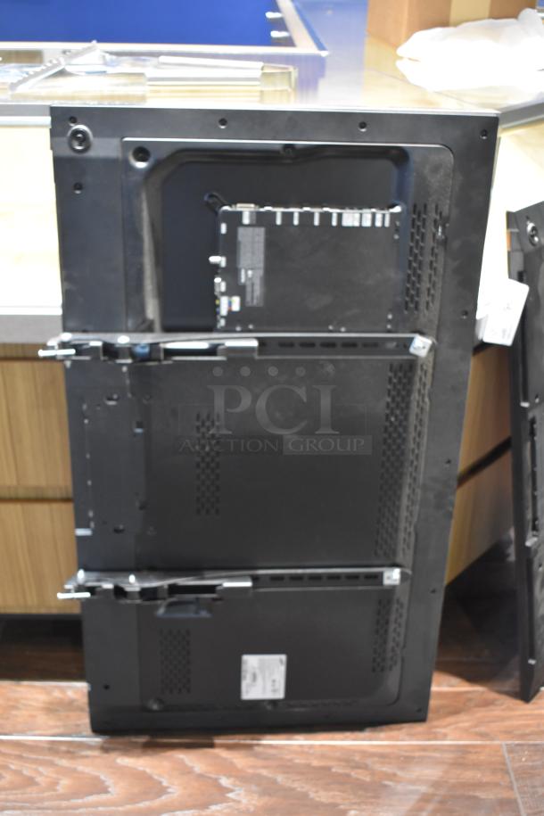 Two Samsung televisions, models ME40C 40" and ME46C 46", back view showing mounting brackets and labels for 100-240 volts.