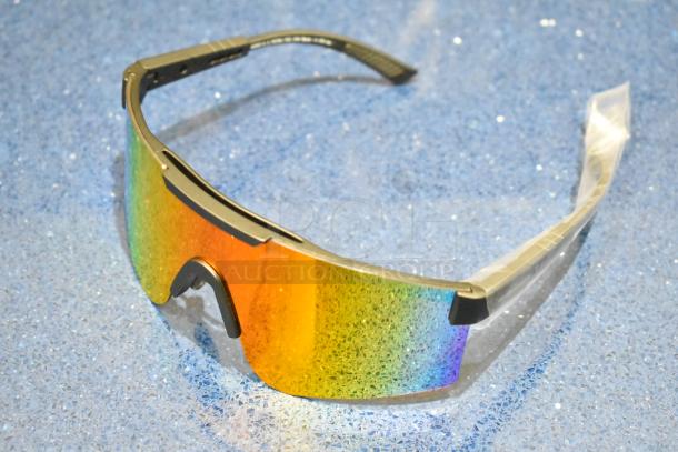 Brand new golden framed sunglasses with orange lens, sleek design, and protective nose piece.