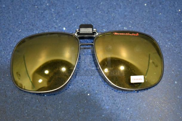 Brand new Moonshades brown framed sunglass attachment with brown lenses, labeled "Taiwan."