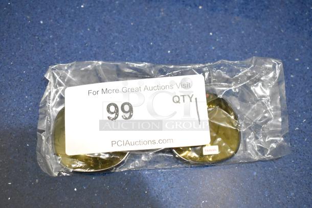 Brand new Moonshades brown framed sunglass attachment with brown lenses, in sealed packaging, labeled "Taiwan."