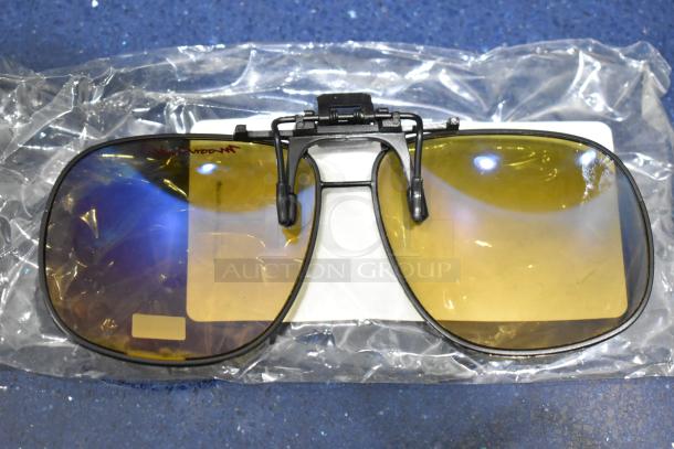 Brand new Moonshades brown framed sunglass attachment with brown lenses, clip-on style, in original packaging.