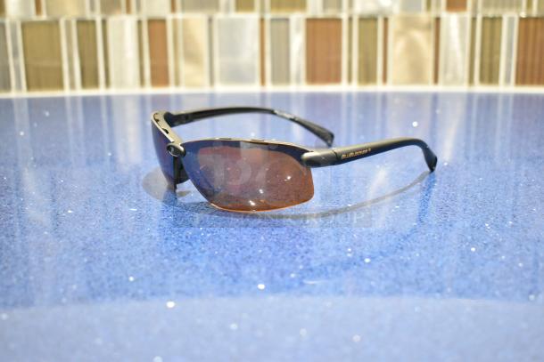 Brand new brown-framed sunglasses with BluBlocker brown lenses, featuring a sleek design for optimal sun protection.