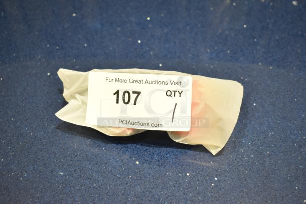 Brand new gray framed sunglasses with BluBlocker orange lens, packaged in plastic. Label shows auction number 107.