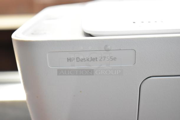 HP DeskJet 2755e printer, scanner, copier in white, showing model label. Mint condition, ideal for home offices.